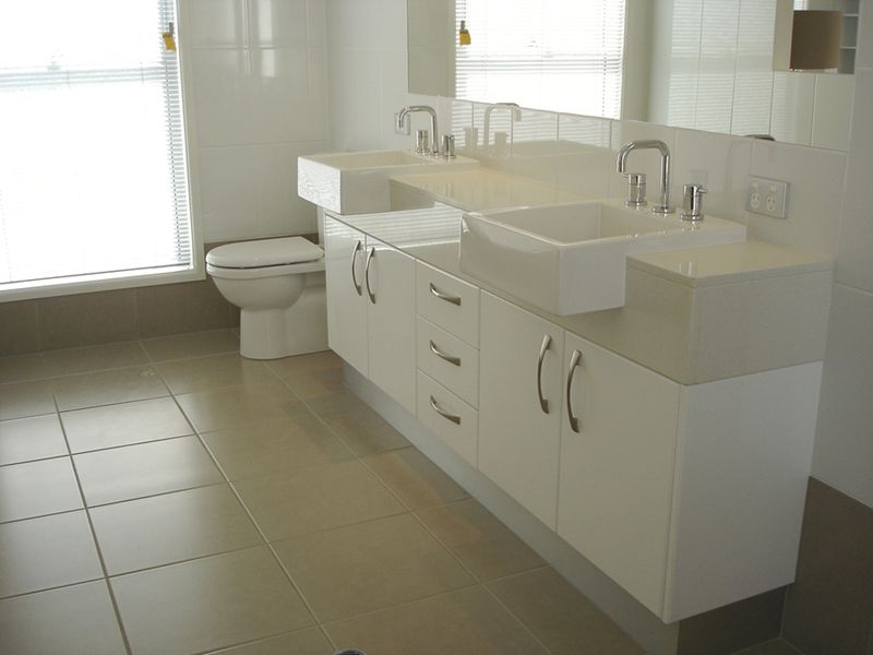 hide plumbing for bathroom cabinet